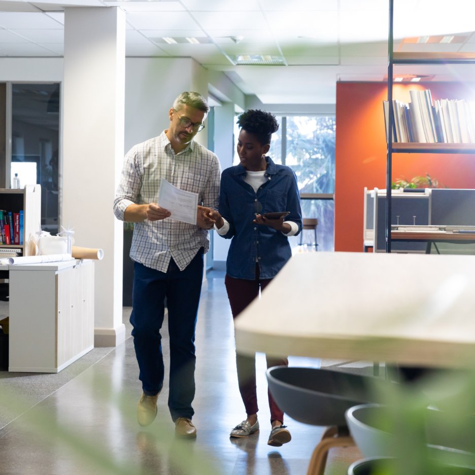 Man and woman discussing a topic at work